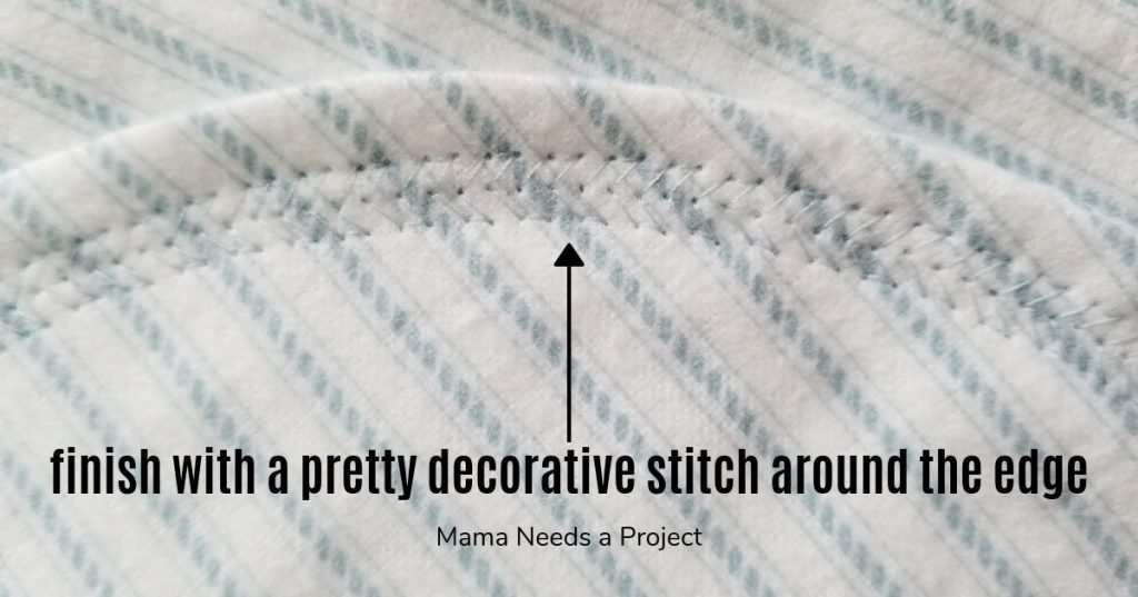 finish blanket with decorative stitching around edge