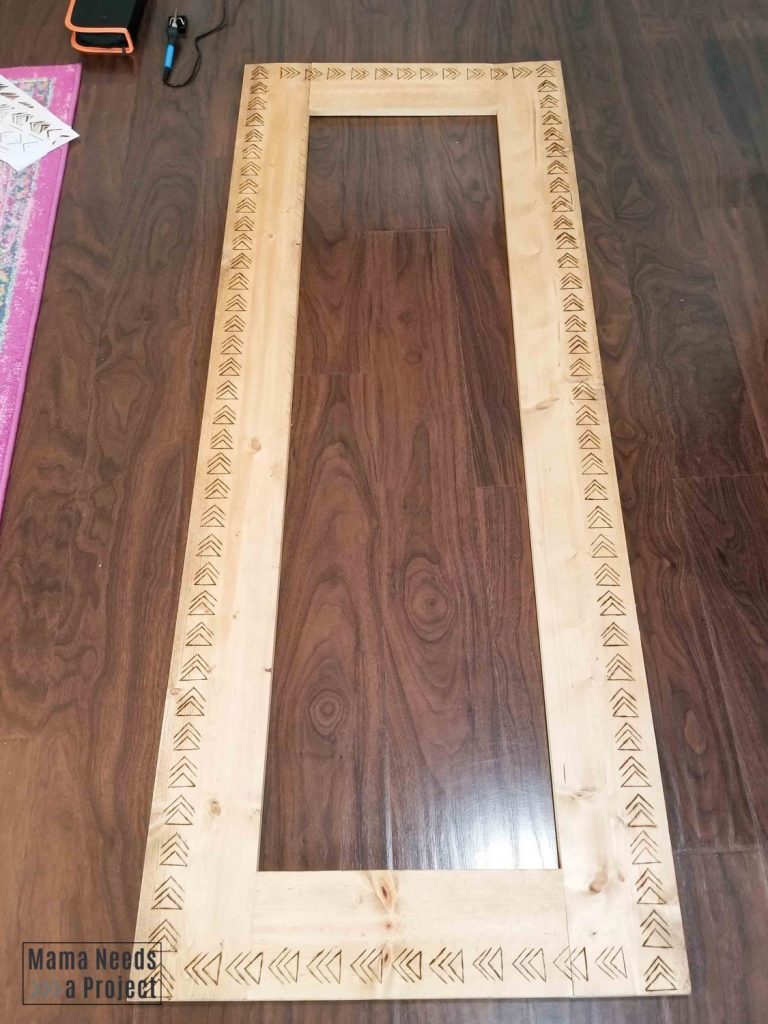 diy boho mirror with mudcloth design starting to be burned into wood