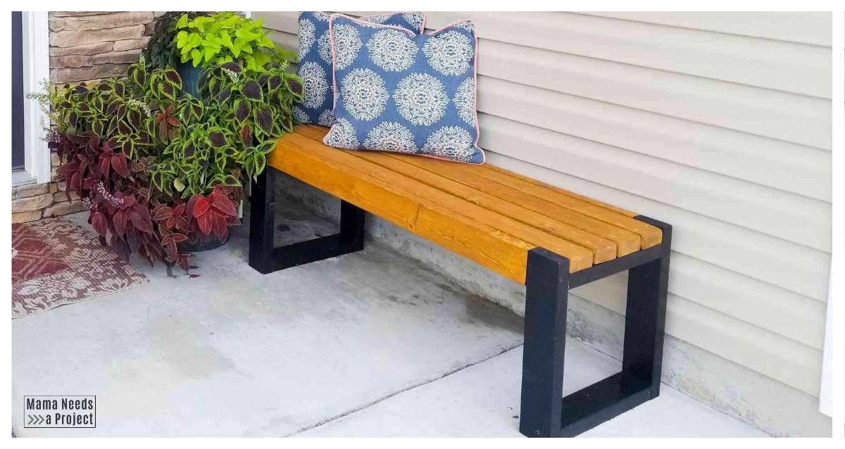 modern 2x4 bench on front porch with plants and pillows