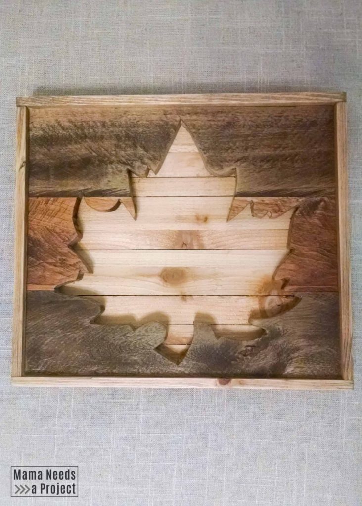 leaf cut out of the center of a piece of wood