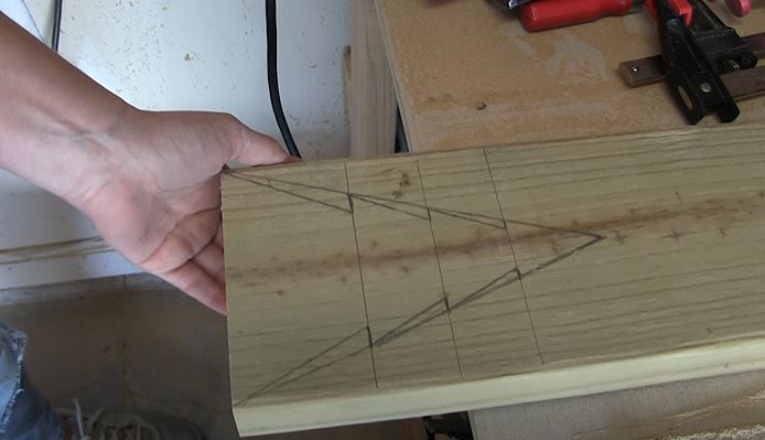 draw christmas tree on 2x6 to cut out with jigsaw