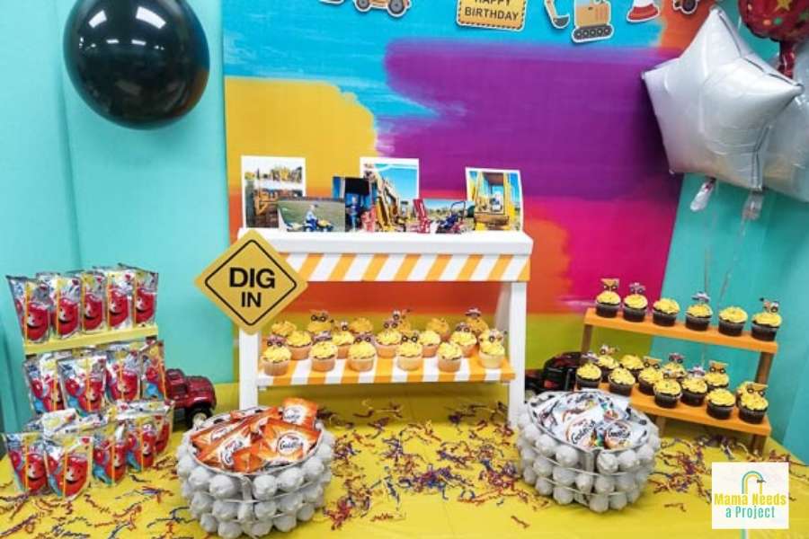 construction birthday party food table with DIY decorations