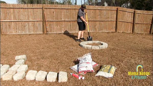 mark the edges of the fire pit with a shovel