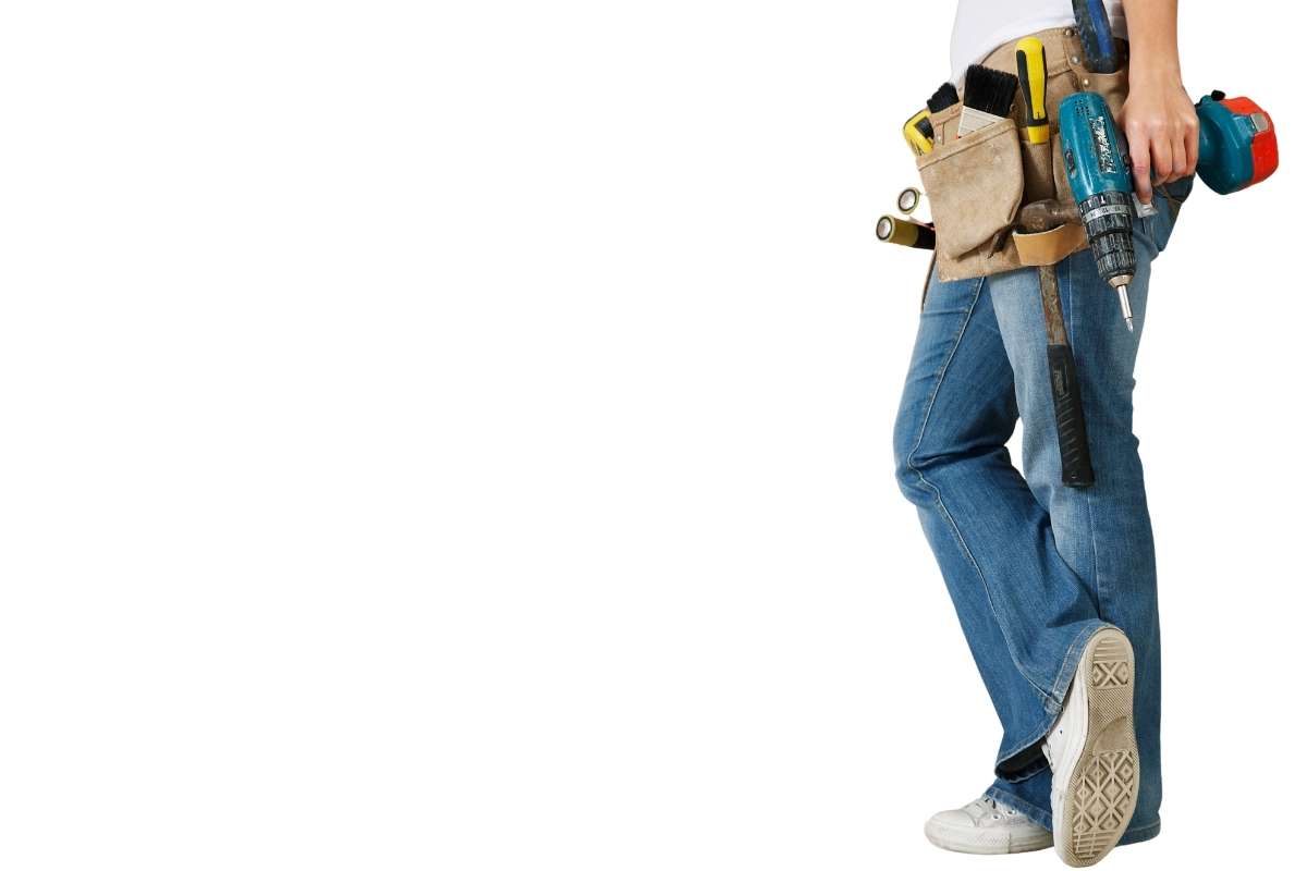 woman with tool belt and drill