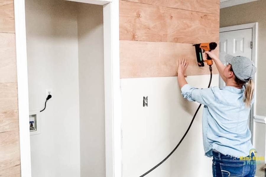 attach wood planks to wall with a nail gun
