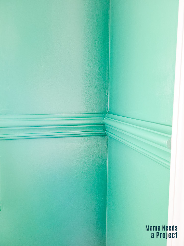 green painted trim, chair rail trim, green wall